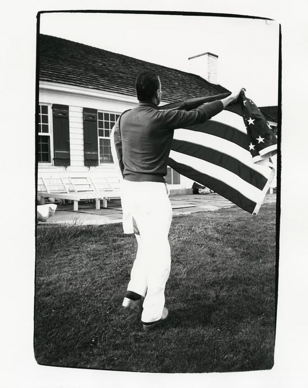 Halston Holding American Flag at Warhol's Montauk Estate, 1982